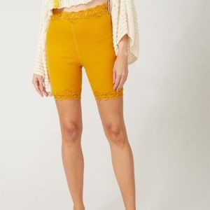 Free People gold lace trim bike short. Size M.